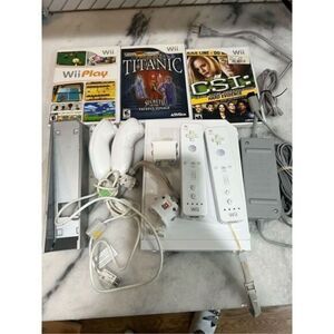 Nintendo Wii lot with multiple controllers and games.